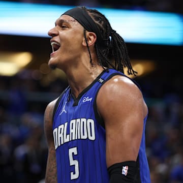 Apr 15, 2025; Orlando, Florida, USA;  Orlando Magic forward Paolo Banchero (5) reacts after a play against the Atlanta Hawks in the fourth quarter at Kia Center. Mandatory Credit: Nathan Ray Seebeck-Imagn Images