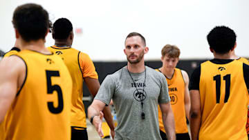 Iowa men’s basketball assistant coach Connor Wheeler high-fives players during practice June 19, 2025 at Carver-Hawkeye Arena in Iowa City, Iowa.