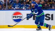 Vancouver Canucks defenseman Filip Hronek makes a pass against the Edmonton Oilers during Game 2 of the second round of the 2024 Stanley Cup Playoffs at Rogers Arena.