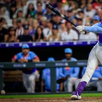 Jul 4, 2025; Denver, Colorado, USA; Colorado Rockies third base Ryan McMahon (24) bats against the Chicago White Sox at Coors Field. Mandatory Credit: Chet Strange-Imagn Images