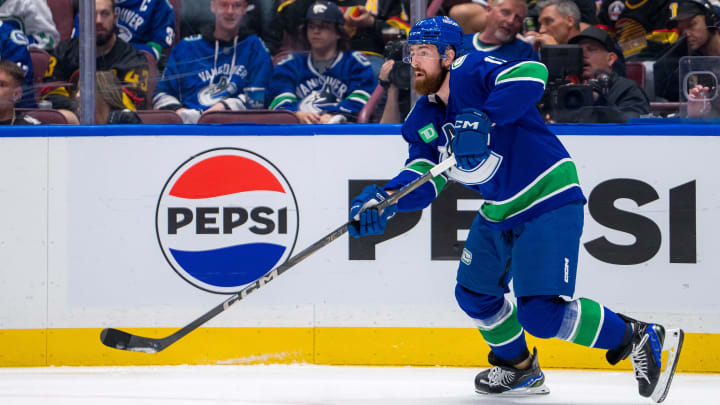 Vancouver Canucks defenseman Filip Hronek makes a pass against the Edmonton Oilers during Game 2 of the second round of the 2024 Stanley Cup Playoffs at Rogers Arena.