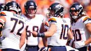 Sep 15, 2024; Denver, Colorado, USA; Denver Broncos quarterback Bo Nix (10) huddles with teammates in the first quarter against the Pittsburgh Steelers at Empower Field at Mile High. 