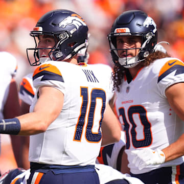 Sep 15, 2024; Denver, Colorado, USA; Denver Broncos quarterback Bo Nix (10) huddles with teammates in the first quarter against the Pittsburgh Steelers at Empower Field at Mile High. 