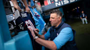 Titans head coach Mike Vrabel signs autographs before a game against the Seahawks in Nashville, Sunday, Dec. 24, 2023.