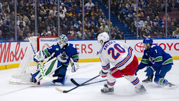 Nov 19, 2024; Vancouver, British Columbia, CAN; Vancouver Canucks defenseman Carson Soucy (7) watches as New York Rangers forward Chris Kreider (20) scores on goalie Arturs Silovs (31) during the third period at Rogers Arena. Mandatory Credit: Bob Frid-Imagn Images