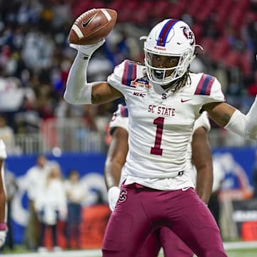 Dec 18, 2021; Atlanta, GA, USA; South Carolina State Bulldogs wide receiver Shaquan Davis (1) reacts after catching a touchdown pass against the Jackson State Tigers during the first half during the 2021 Celebration Bowl at Mercedes-Benz Stadium. Mandatory Credit: Dale Zanine-Imagn Images