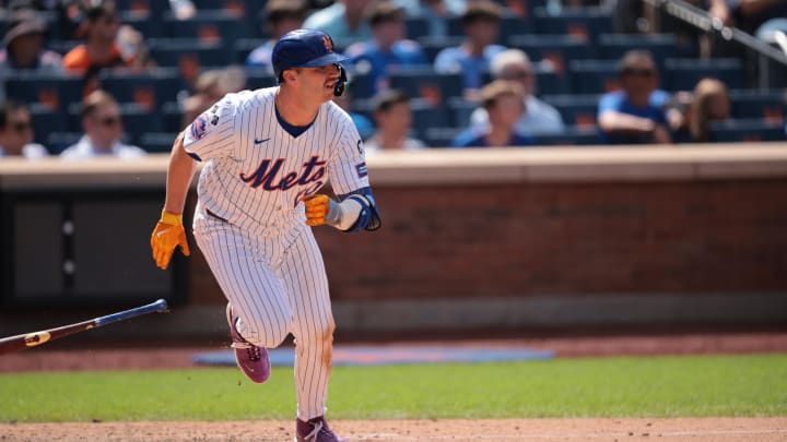 Aug 21, 2024; New York City, New York, USA; New York Mets first baseman Pete Alonso (20) singles during the eighth inning against the Baltimore Orioles at Citi Field. Mandatory Credit: Vincent Carchietta-USA TODAY Sports