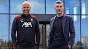 Richard Hughes (right) arrived at Liverpool on the same day as Arne Slot