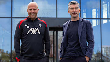 Richard Hughes (right) arrived at Liverpool on the same day as Arne Slot