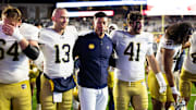 Nov 1, 2025; Chestnut Hill, Massachusetts, USA; Notre Dame Fighting Irish head coach Marcus Freeman, Notre Dame Fighting Irish quarterback CJ Carr (13) and Notre Dame Fighting Irish defensive lineman Donovan Hinish (41) after the game against the Boston College Eagles at Alumni Stadium. Mandatory Credit: Edward Finan-Imagn Images