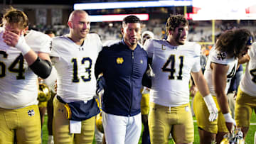 Nov 1, 2025; Chestnut Hill, Massachusetts, USA; Notre Dame Fighting Irish head coach Marcus Freeman, Notre Dame Fighting Irish quarterback CJ Carr (13) and Notre Dame Fighting Irish defensive lineman Donovan Hinish (41) after the game against the Boston College Eagles at Alumni Stadium. Mandatory Credit: Edward Finan-Imagn Images