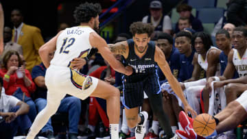 Oct 10, 2023; New Orleans, Louisiana, USA; Orlando Magic guard Trevelin Queen (12) dribbles against New Orleans Pelicans forward Kaiser Gates (12) during the fourth quarter at the Smoothie King Center. Mandatory Credit: Matthew Hinton-USA TODAY Sports