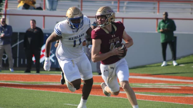 Mainland defensive lineman LJ McCray pursues St. Augustine quarterback Locklan Hewlett during the FHSAA Class 3S high school 