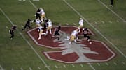 Oct 17, 2019; Stanford, CA, USA;  UCLA Bruins running back Demetric Felton (10) throws a pass at midfield on the Stanford Cardinal logo in the third quarter at Stanford Stadium. UCLA defeated Stanford 34-16. Mandatory Credit: Kirby Lee-Imagn Images