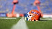 Nov 23, 2024; Gainesville, Florida, USA; A Florida Gators helmet sits on the field before a game against the Mississippi Rebels at Ben Hill Griffin Stadium. Mandatory Credit: Matt Pendleton-Imagn Images