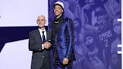 Penn State's Yanic Konan Niederhauser poses with NBA Commissioner Adam Silver after being selected as the 30th pick by the Los Angeles Clippers in the first round of the 2025 NBA Draft.