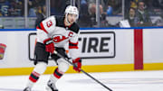 Oct 30, 2024; Vancouver, British Columbia, CAN; New Jersey Devils forward Nico Hischier (13) skates against the Vancouver Canucks during the first period at Rogers Arena. Mandatory Credit: Bob Frid-Imagn Images
