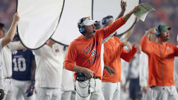 Sep 6, 2025; Auburn, Alabama, USA;  Auburn Tigers head coach Hugh Freeze signals a play during the fourth quarter against the Ball State Cardinals at Jordan-Hare Stadium. Mandatory Credit: John Reed-Imagn Images