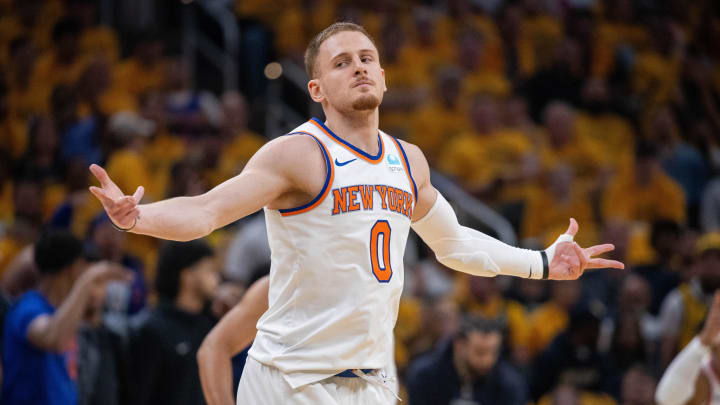 May 17, 2024; Indianapolis, Indiana, USA; New York Knicks guard Donte DiVincenzo (0) reacts after a made basket during game six of the second round for the 2024 NBA playoffs against the Indiana Pacers at Gainbridge Fieldhouse. Mandatory Credit: Trevor Ruszkowski-USA TODAY Sports