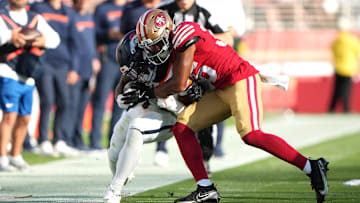 Denver Broncos wide receiver R.J. Harvey (L) and San Francisco 49ers safety Marques Sigle (R)