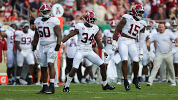 Sep 16, 2023; Tampa, Florida, USA;  Alabama Crimson Tide linebacker Dallas Turner (15) Alabama Crimson Tide linebacker Quandarrius Robinson (34) and Alabama Crimson Tide defensive lineman Tim Smith (50) celebrate after forcing a turnover against the South Florida Bulls in the second quarter at Raymond James Stadium. Mandatory Credit: Nathan Ray Seebeck-USA TODAY Sports