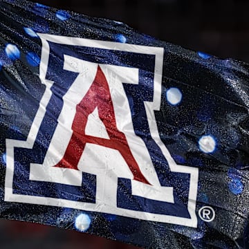 Sep 7, 2024; Tucson, Arizona, USA; Arizona Wildcats flag waves in the air right before a game against the Northern Arizona Lumberjacks at Arizona Stadium