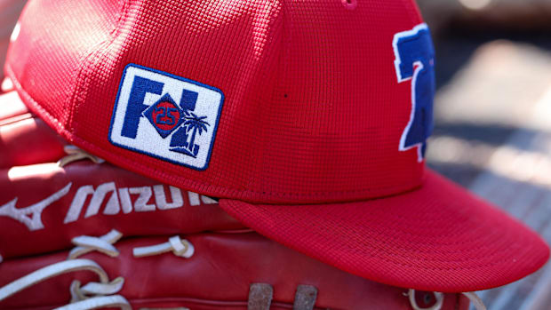 Philadelphia Phillies red spring training hat with a Florida spring training logo on the side and the script P on the front