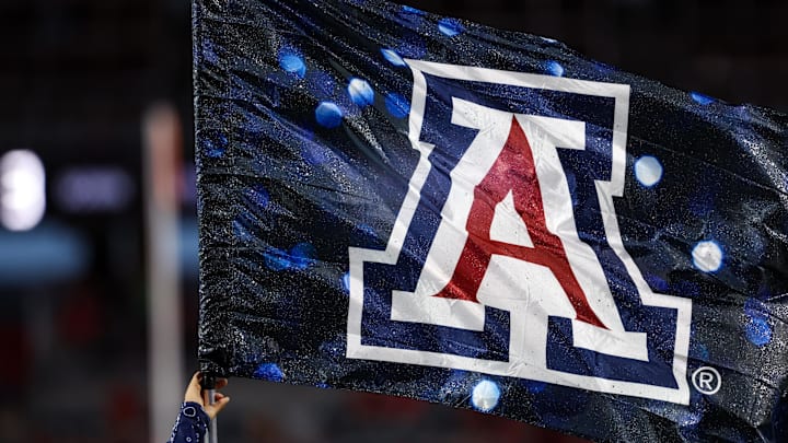 Sep 7, 2024; Tucson, Arizona, USA; Arizona Wildcats flag waves in the air right before a game against the Northern Arizona Lumberjacks at Arizona Stadium