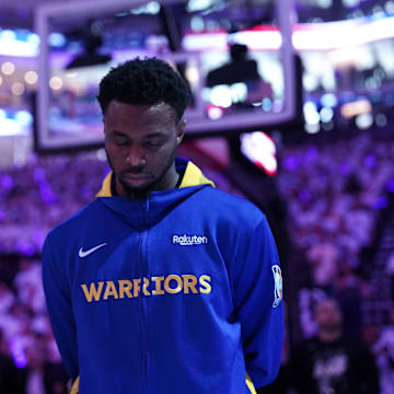 Apr 15, 2023; Sacramento, California, USA; Golden State Warriors forward Andrew Wiggins (22) stands on the court before their game against the Sacramento Kings during the national anthem during game one of the 2023 NBA playoffs at the Golden 1 Center. Mandatory Credit: Cary Edmondson-Imagn Images