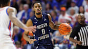 North Florida Ospreys guard Jasai Miles (0) dribbles the ball against the Florida Gators during the first half at Exactech Arena at the Stephen C. O'Connell Center.
