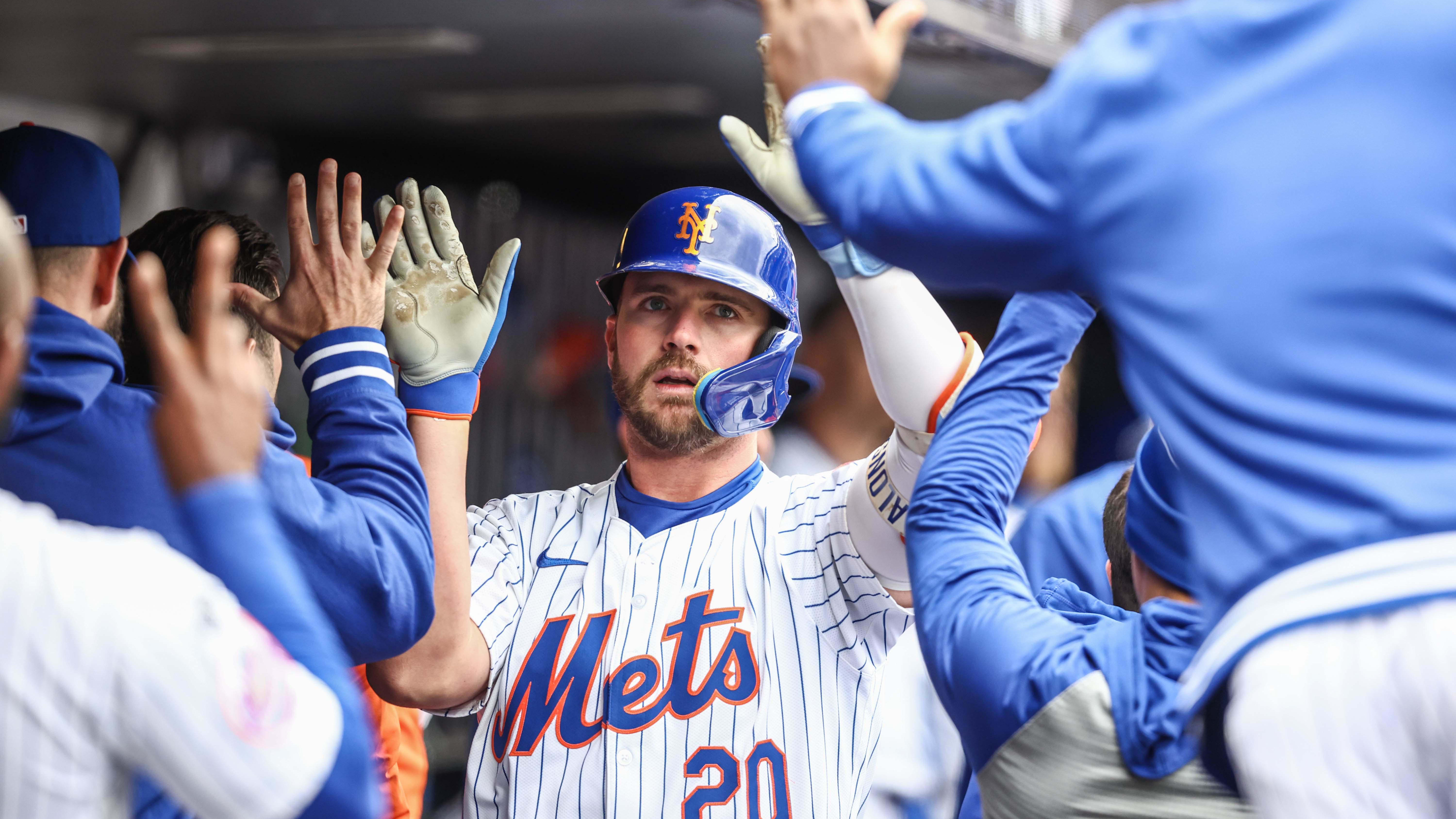 Apr 13, 2024; New York City, New York, USA;  New York Mets first baseman Pete Alonso (20) is greeted in the dugout.