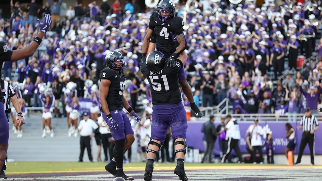 Nov 23, 2024; Fort Worth, Texas, USA; TCU Horned Frogs running back Cam Cook (4) celebrates with offensive lineman Coltin Deery (51) after scoring a touchdown against the Arizona Wildcats in the third quarter at Amon G. Carter Stadium. Mandatory Credit: Tim Heitman-Imagn Images Nov 23, 2024; Fort Worth, Texas, USA; TCU Horned Frogs running back Cam Cook (4) celebrates with offensive lineman Coltin Deery (51) after scoring a touchdown against the Arizona Wildcats in the third quarter at Amon G. Carter Stadium. Mandatory Credit: Tim Heitman-Imagn Images
