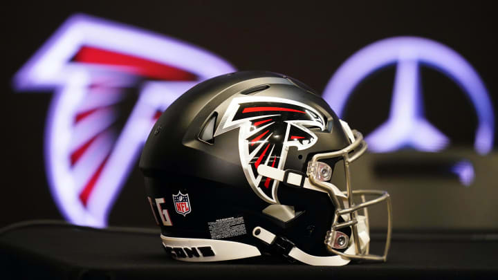 Feb 5, 2024; Atlanta, GA, USA; Atlanta Falcons helmet on the table before Raheem Morris is introduced as the new head coach of the Atlanta Falcons at Mercedes-Benz Stadium. Mandatory Credit: John David Mercer-USA TODAY Sports