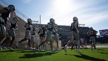 Kansas State Wildcats take the field before the game against UCF Knights at Bill Snyder Family Stadium.