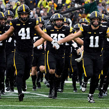 Take a shot on Iowa to upset USC in college football Week 12 action.
