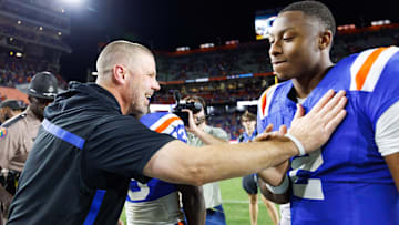 Oct 18, 2025; Gainesville, Florida, USA; Florida Gators head coach Billy Napier celebrates with quarterback DJ Lagway (2) after a game against the Mississippi State Bulldogs at Ben Hill Griffin Stadium. Mandatory Credit: Matt Pendleton-Imagn Images