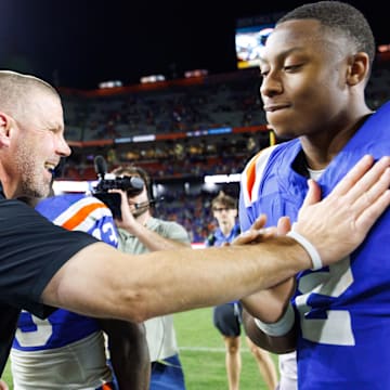 Oct 18, 2025; Gainesville, Florida, USA; Florida Gators head coach Billy Napier celebrates with quarterback DJ Lagway (2) after a game against the Mississippi State Bulldogs at Ben Hill Griffin Stadium. Mandatory Credit: Matt Pendleton-Imagn Images