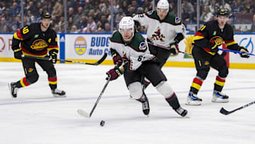 Apr 10, 2024; Vancouver, British Columbia, CAN; Arizona Coyotes forward Matias Maccelli (63) handles the puck against the Vancouver Canucks in the second period at Rogers Arena. Mandatory Credit: Bob Frid-USA TODAY Sports