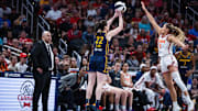 Jun 17, 2025; Indianapolis, Indiana, USA; Indiana Fever guard Caitlin Clark (22) shoots the ball while Connecticut Sun guard Jacy Sheldon (4) defends in the second half at Gainbridge Fieldhouse. Mandatory Credit: Trevor Ruszkowski-Imagn Images
