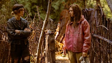L-R: Sophie Thatcher as Teen Natalie and Sophie Nélisse as Teen Shauna in Yellowjackets, episode 6, season 3, streaming on Paramount+ with SHOWTIME, 2025. Photo Credit: Colin Bentley/Paramount+ with SHOWTIME.