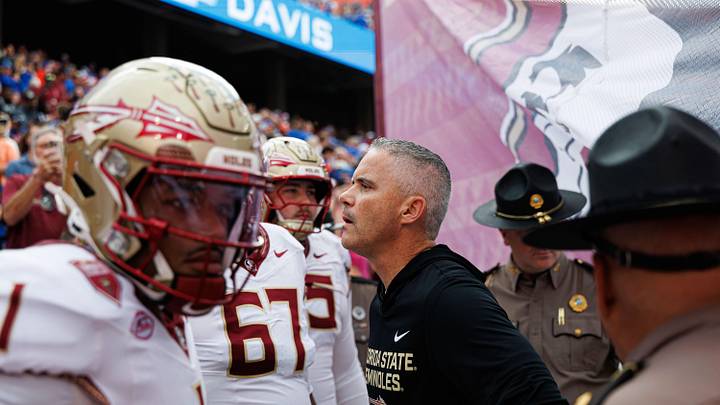 Nov 29, 2025; Gainesville, Florida, USA; Florida State Seminoles head coach Mike Norvell waits to run on the field before a game against the Florida Gators at Ben Hill Griffin Stadium. Mandatory Credit: Matt Pendleton-Imagn Images