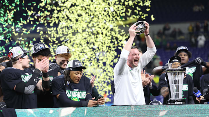 Dec 7, 2024; Indianapolis, IN, USA; Oregon Ducks head coach Dan Lanning and the Oregon Ducks celebrate defeating the Penn State Nittany Lions to win the Big Ten Championship in the 2024 Big Ten Championship game at Lucas Oil Stadium.