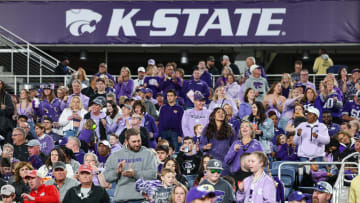 Dec 28, 2023; Orlando, FL, USA;  Kansas State Wildcats fans cheer during the Pop-Tarts bowl against the North Carolina State Wolfpack at Camping World Stadium. Mandatory Credit: Nathan Ray Seebeck-USA TODAY Sports