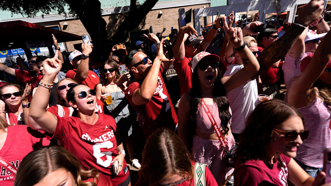 Oklahoma fans cheer as Oklahoma arrives before the Red River Rivalry college football game between the University of Oklahoma Sooners and the Texas Longhorn at the Cotton Bowl Stadium in Dallas, Texas, Saturday, Oct. 11, 2025.