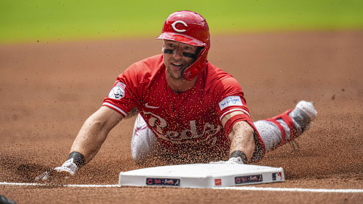 Jul 24, 2024; Cumberland, Georgia, USA; Cincinnati Reds first baseman Spencer Steer (7) slides into third base after hitting a triple against the Atlanta Braves during the first inning at Truist Park. Jul 24, 2024; Cumberland, Georgia, USA; Cincinnati Reds first baseman Spencer Steer (7) slides into third base after hitting a triple against the Atlanta Braves during the first inning at Truist Park.