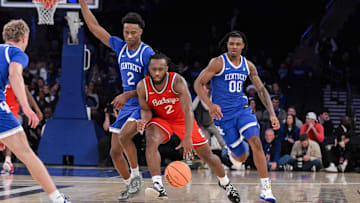 Dec 21, 2024; New York, New York, USA; Ohio State Buckeyes guard Bruce Thornton (2) brings the ball up court while being defended by Kentucky Wildcats guard Jaxson Robinson (2) during the second half at Madison Square Garden. Mandatory Credit: John Jones-Imagn Images