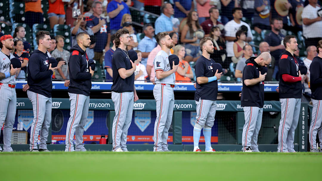 Jun 15, 2025; Houston, Texas, USA; Minnesota Twins players stand during the National Anthem prior to the game against the Houston Astros at Daikin Park. Mandatory Credit: Erik Williams-Imagn Images
