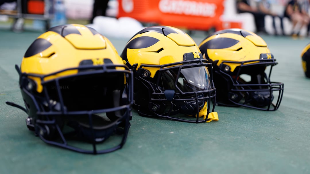 Dec 31, 2024; Tampa, FL, USA; Michigan Wolverines helmets sit on the field before a game against the Alabama Crimson Tide at Raymond James Stadium. Mandatory Credit: Matt Pendleton-Imagn Images