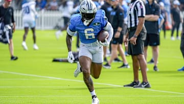 Carolina Panthers running back Miles Sanders carries the ball at Carolina Panthers Practice Fields. 
