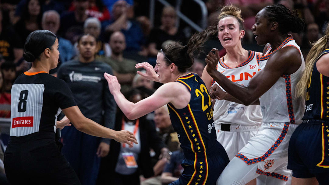 Jun 17, 2025; Indianapolis, Indiana, USA; Connecticut Sun guard Marina Mabrey (3) fouls Indiana Fever guard Caitlin Clark (22)  in the second half at Gainbridge Fieldhouse. Mandatory Credit: Trevor Ruszkowski-Imagn Images